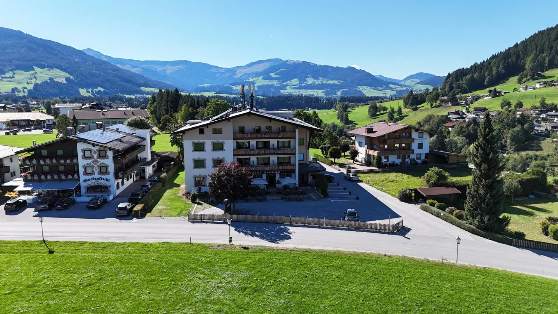 View of a landscape with buildings and mountains.